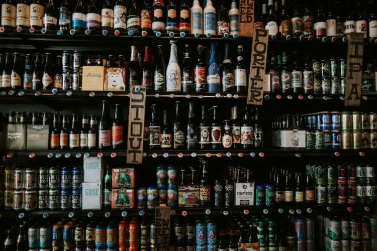 Many bottles of beer on shelves